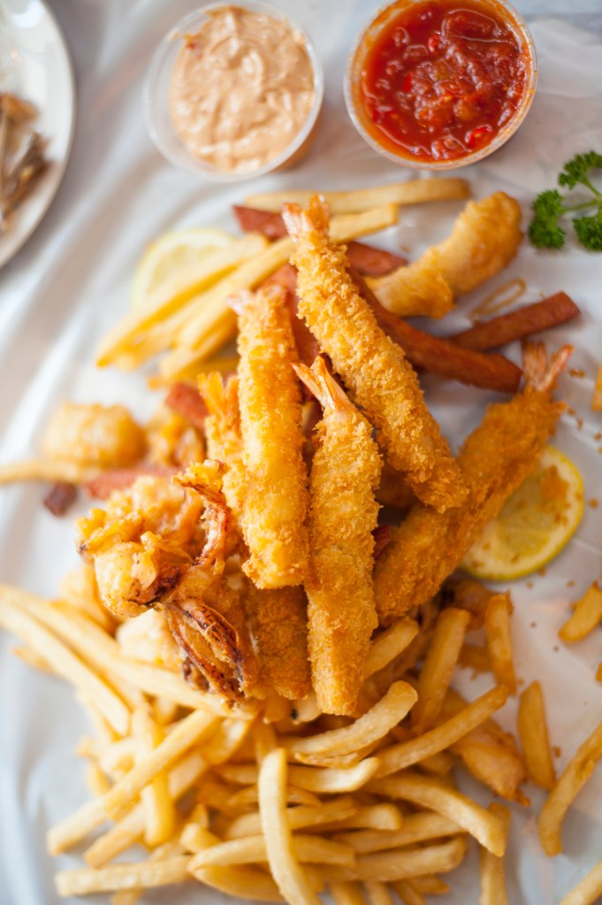 Calabash style fried shrimp, French fries, and dipping sauces