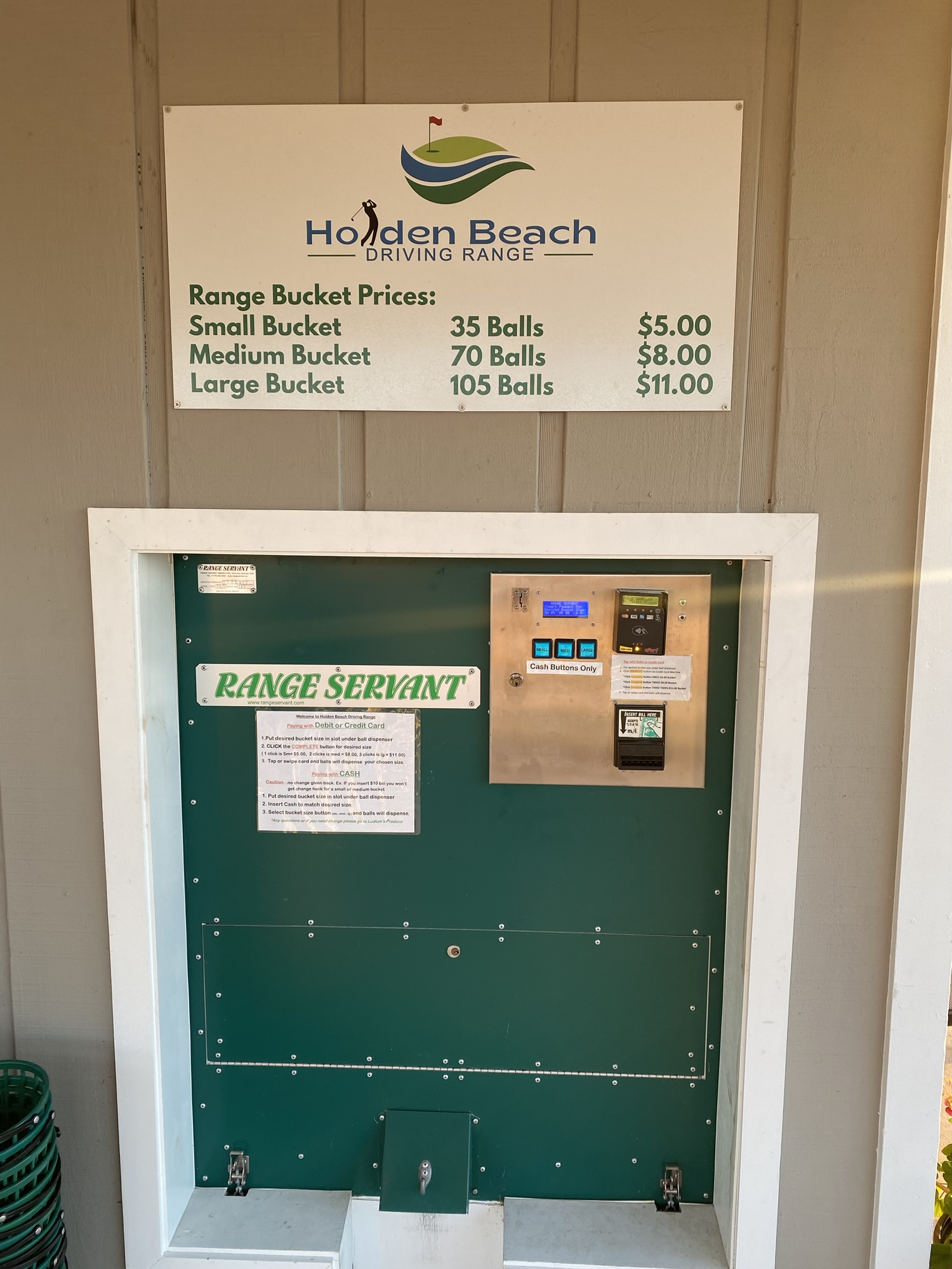 Golf ball dispenser and pricing sign at Holden Beach Driving Range