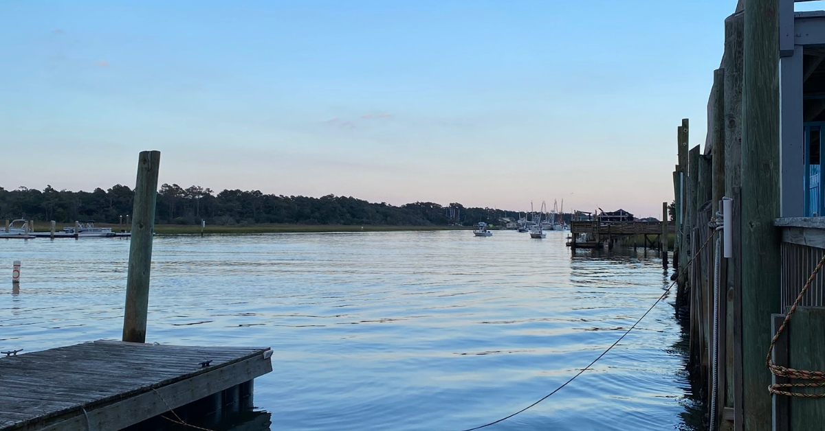 View of the marina docks and calm water at Holden Beach