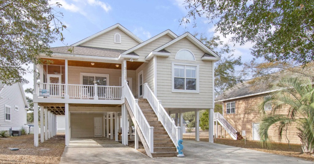 Front view of Old Ferry Coastal Retreat vacation home on stilts